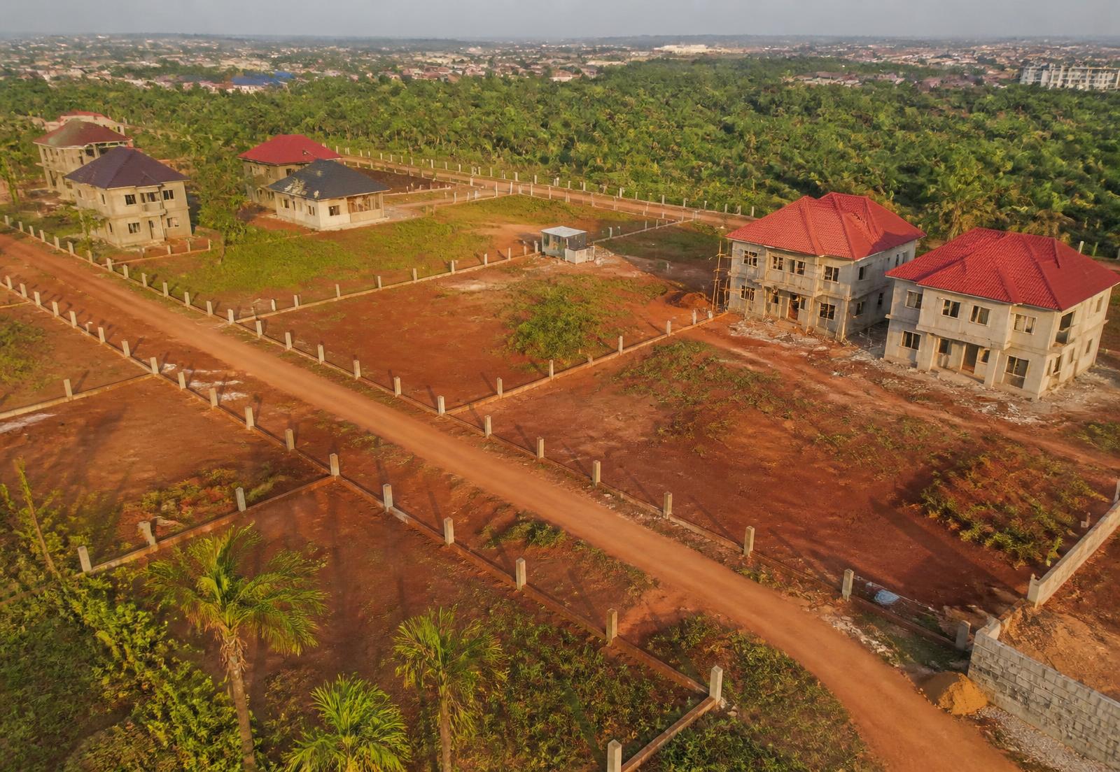 Aerial view of surveyed residential land plots in a Nigerian estate at sunset